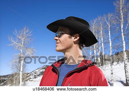 Cowboy wearing sunglasses and cowboy hat in winter. View Large Photo Image Stock Photograph - Cowboy wearing sunglasses and cowboy hat in winter.. Fotosearch