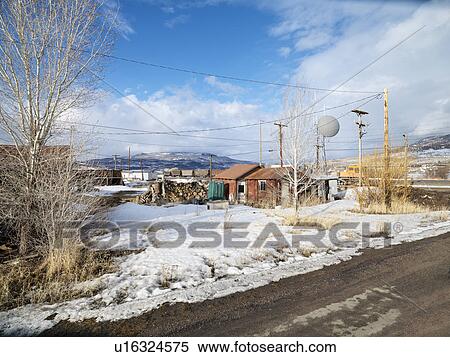 House with firewood with dirt road in foreground View Large Photo Image Stock Photography - House with firewood with dirt road in foreground. Fotosearch