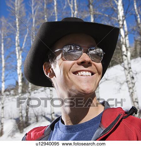 Male in sunglasses and a hat View Large Photo Image Stock Photography - Male in sunglasses and a hat. Fotosearch