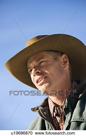 Male wearing a cowboy hat View Large Photo Image Stock Image - Male wearing a cowboy hat. Fotosearch