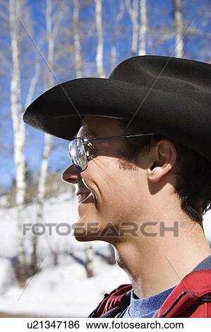 Male wearing sunglasses and cowboy hats View Large Photo Image Stock Photograph - Male wearing sunglasses and cowboy hats. Fotosearch