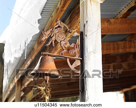 Rusted bell on side post of shed View Large Photo Image Stock Photography - Rusted bell on side post of shed. Fotosearch