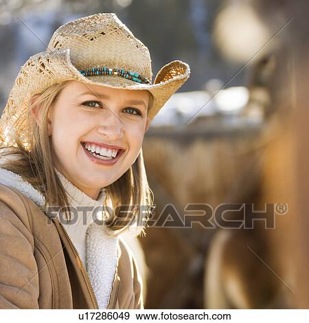Woman wearing cowboy hat View Large Photo Image Stock Photo - Woman wearing cowboy hat . Fotosearch