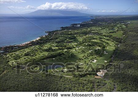 Aerial of golf course on Maui, Hawaii coastline with Pacific ocean. View Large Photo Image Stock Photo - Aerial of golf course on Maui, Hawaii coastline with Pacific ocean.. Fotosearch