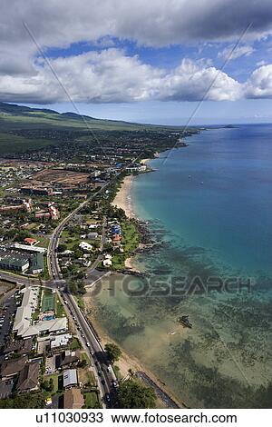 Aerial of Maui, Hawaii coastline with beach, road and buildings View Large Photo Image Stock Image - Aerial of Maui, Hawaii coastline with beach, road and buildings. Fotosearch