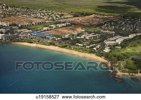 Aerial of Maui, Hawaii coastline with buildings and beach View Large Photo Image Stock Photo - Aerial of Maui, Hawaii coastline with buildings and beach. Fotosearch