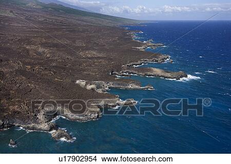 Picture - Aerial of Pacific ocean and Maui, Hawaii coast with lava rocks.. Fotosearch