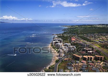 Stock Image - Aerial view of buildings on coastline of Maui, Hawaii.. Fotosearch
