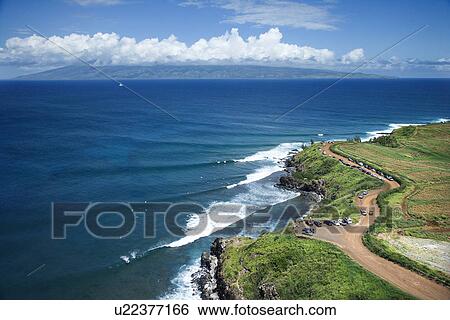 Aerial view of coastline with surfers and parked cars on Maui, Hawaii View Large Photo Image Stock Photograph - Aerial view of coastline with surfers and parked cars on Maui, Hawaii . Fotosearch