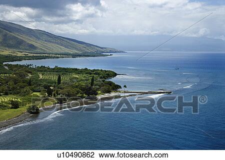 Stock Image - Aerial view of jetty on coastline of Maui, Hawaii. Fotosearch
