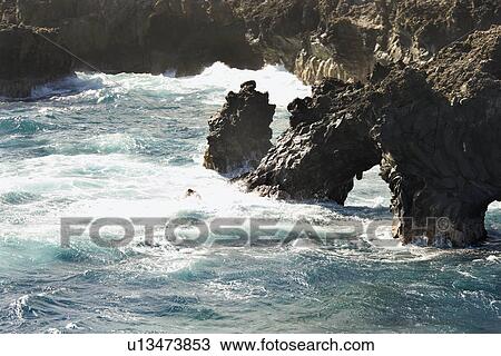 Pacific ocean rocky beach alcove in Maui, Hawaii. View Large Photo Image Stock Image - Pacific ocean rocky beach alcove in Maui, Hawaii.. Fotosearch