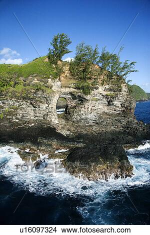 Picture - Rocky coast in Pacific ocean in Maui, Hawaii. Fotosearch