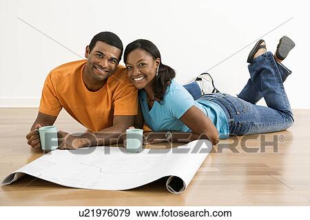 African American male and female couple with architectural blueprints drinking coffee. View Large Photo Image Stock Photo - African American male and female couple with architectural blueprints drinking coffee.. Fotosearch