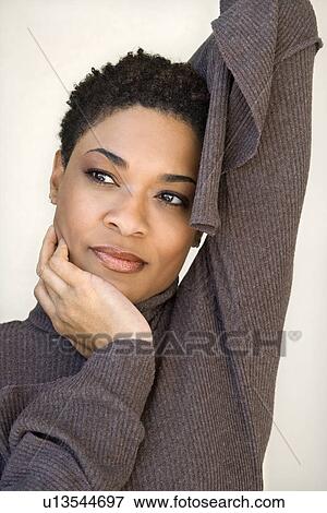 Close up of African- American woman with head on hand. View Large Photo Image Stock Photo - Close up of African- American woman with head on hand.. Fotosearch