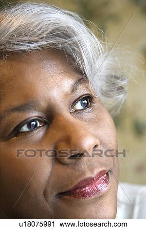 Close up portrait of mature African American woman looking to the side. View Large Photo Image Stock Image - Close up portrait of mature African American woman looking to the side.. Fotosearch