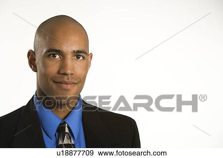 Stock Photo - Head and shoulder portrait of African American man in suit.. Fotosearch