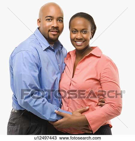 Portrait of African American couple with arms around eachother against white background. View Large Photo Image Stock Image - Portrait of African American couple with arms around eachother against white background.. Fotosearch