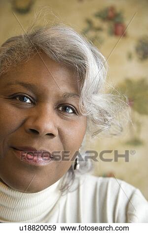 Portrait of mature African American woman looking at the viewer. View Large Photo Image Stock Photo - Portrait of mature African American woman looking at the viewer.. Fotosearch