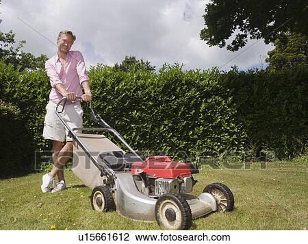 Man with push lawnmower View Large Photo Image Stock Image - Man with push lawnmower. Fotosearch