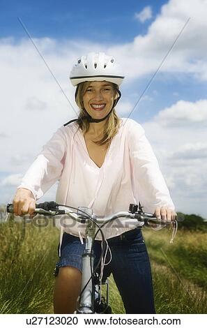 Stock Image - Portrait of female cyclist. Fotosearch