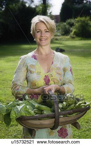 Portrait of women with vegetable basket View Large Photo Image Stock Image - Portrait of women with vegetable basket. Fotosearch