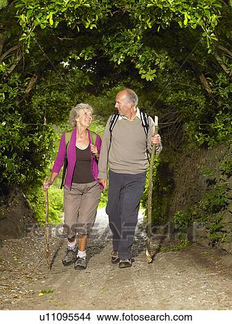 Senior couple hiking View Large Photo Image Picture - Senior couple hiking. Fotosearch