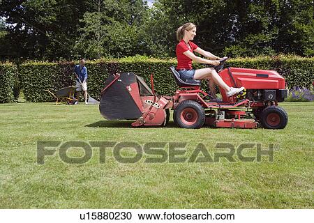 Women mowing lawn View Large Photo Image Stock Image - Women mowing lawn. Fotosearch