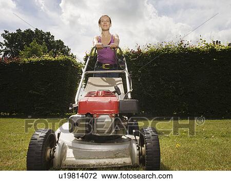 Women with push lawnmower View Large Photo Image Stock Image - Women with push lawnmower. Fotosearch