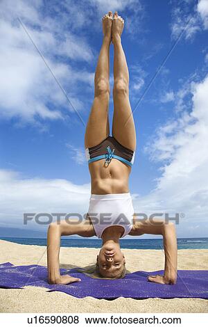 Caucasian young adult woman doing yoga on beach. View Large Photo Image Stock Photo - Caucasian young adult woman doing yoga on beach.. Fotosearch