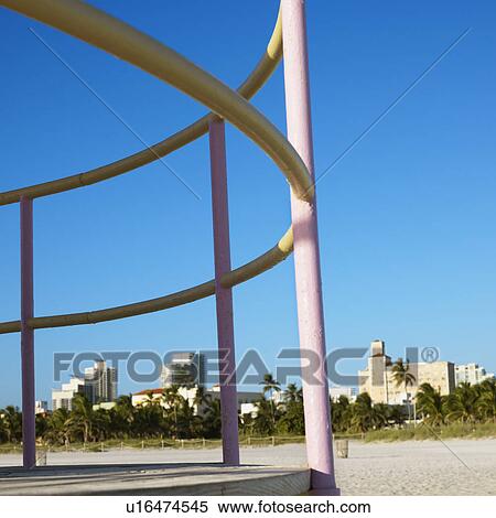 Pink and yellow painted railings of lifeguard tower on beach in Miami, Florida, USA. View Large Photo Image Stock Photography - Pink and yellow painted railings of lifeguard tower on beach in Miami, Florida, USA.. Fotosearch