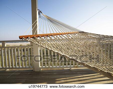 Stock Image - Porch with hammock at beach at Bald Head Island, North Carolina. Fotosearch