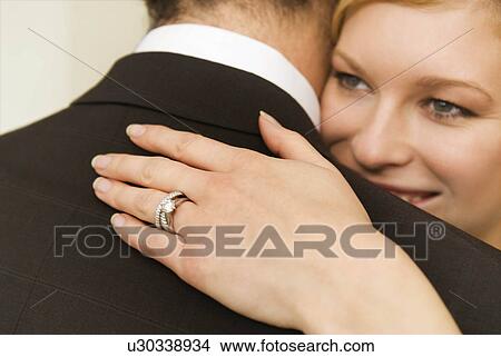 A bride hugs her husband View Large Photo Image Picture - A bride hugs her husband. Fotosearch