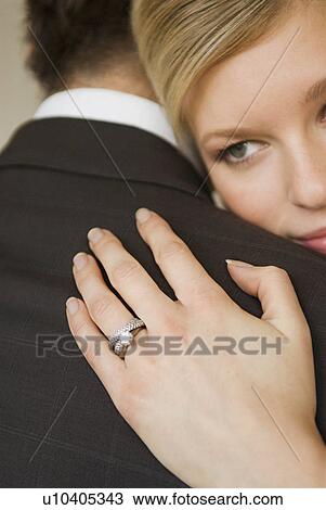 A bride hugs her husband View Large Photo Image Stock Image - A bride hugs her husband. Fotosearch