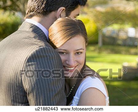 Stock Image - A wedding couple in the church garden. Fotosearch