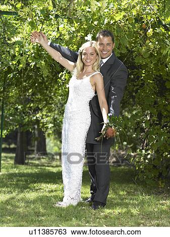 Bride and groom celebrating View Large Photo Image Stock Image - Bride and groom celebrating. Fotosearch