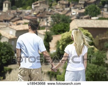 Couple admiring view View Large Photo Image Stock Photo - Couple admiring view. Fotosearch