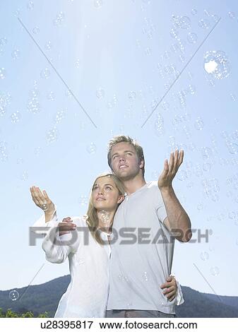Couple in sun View Large Photo Image Stock Photo - Couple in sun. Fotosearch