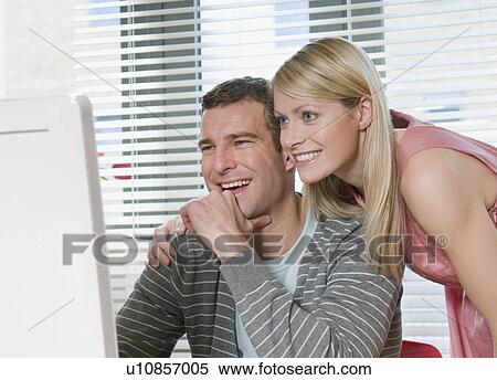 Couple working from home View Large Photo Image Stock Photography - Couple working from home. Fotosearch