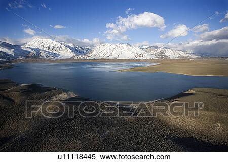 Stock Photography - Aerial landscape of lake and mountains at Lake Crowley, California.. Fotosearch