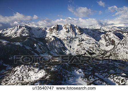 Aerial of snow covered mountain landscape in California View Large Photo Image Stock Photo - Aerial of snow covered mountain landscape in California. Fotosearch