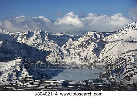 Aerial of snowy mountain landscape with frozen lake in Inyo National Forest, California, USA View Large Photo Image Picture - Aerial of snowy mountain landscape with frozen lake in Inyo National Forest, California, USA. Fotosearch