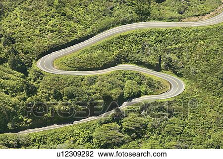 Stock Image - Aerial of winding country road Shoreline Highway in California, USA.. Fotosearch