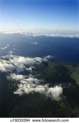 Aerial view of mountain landscape with clouds on Maui, Hawaii. View Large Photo Image Picture - Aerial view of mountain landscape with clouds on Maui, Hawaii.. Fotosearch