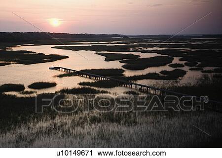 Aerial view of pier in coastal wetland on Bald Head Island, North Carolina View Large Photo Image Stock Image - Aerial view of pier in coastal wetland on Bald Head Island, North Carolina. Fotosearch