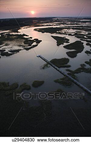 Aerial view of pier in coastal wetland on Bald Head Island, North Carolina. View Large Photo Image Stock Image - Aerial view of pier in coastal wetland on Bald Head Island, North Carolina.. Fotosearch