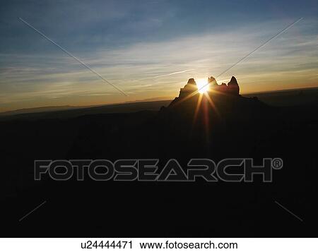 Sun shining through butte at Monument Valley View Large Photo Image Stock Image - Sun shining through butte at Monument Valley. Fotosearch