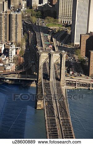 Aerial view of Brooklyn Bridge with New York City buildings. View Large Photo Image Stock Photo - Aerial view of Brooklyn Bridge with New York City buildings.. Fotosearch