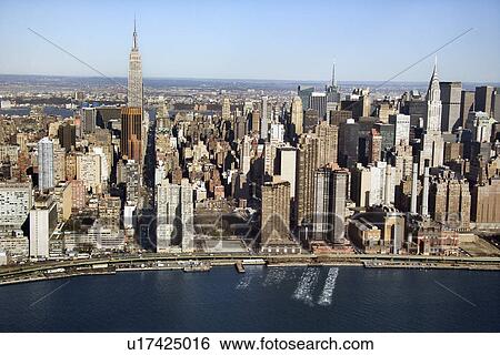 Stock Photograph - Aerial view of Manhattan and East River in New York City. Fotosearch