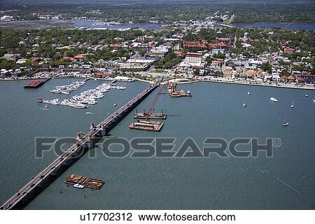 Stock Image - Aerial view of ships and boats in water with Bridge of Lions in Saint Augustine, Florida. . Fotosearch