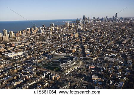 Aerial view of Wrigley Field with Chicago, Illinois skyline in background. View Large Photo Image Picture - Aerial view of Wrigley Field with Chicago, Illinois skyline in background.. Fotosearch